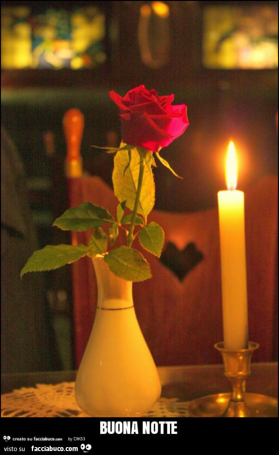 Rosa rossa e candela. Buona notte